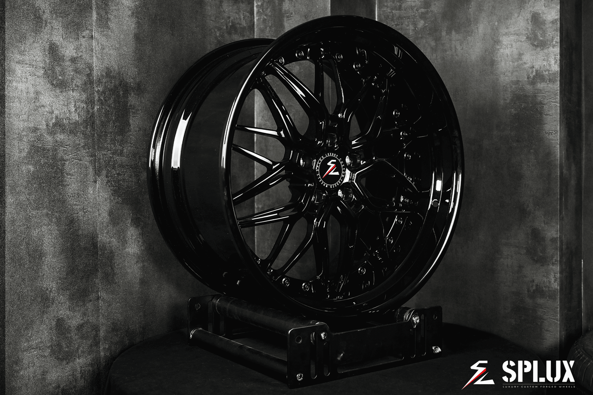 Dodge Challenger staggered wheels with a gloss black finish in 20 inch. Custom forged aftermarket rims for the Challenger.