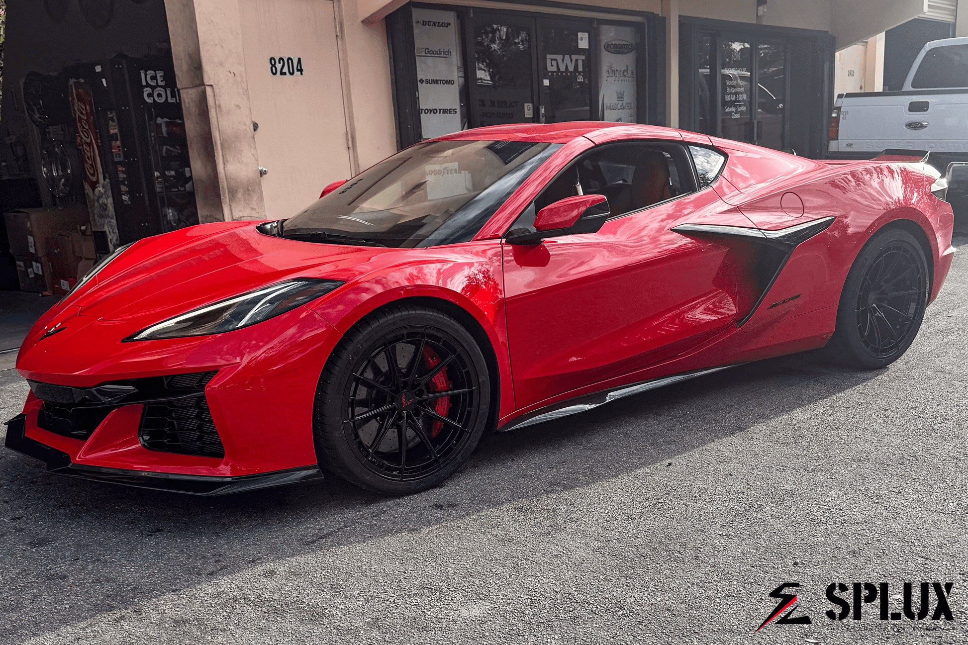 Splux SL-C07 Forged 2-Piece rims on torch red Corvette C8 with ultra concave design and black accents.