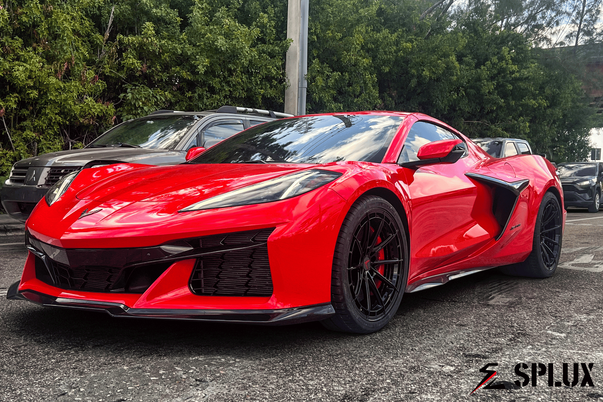 Torch red Splux SL-C07 Forged 2-Piece wheels on Corvette C8, featuring ultra concave design and custom emblem caps.