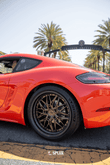 Porsche 718 with Splux SD-01S bronze deep dish rims featuring carbon fiber wrapped lip and step lip design.