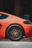 Porsche with Splux SD-01S forged rims featuring carbon fiber wrapped lip, bronze finish, and luxury deep dish design.