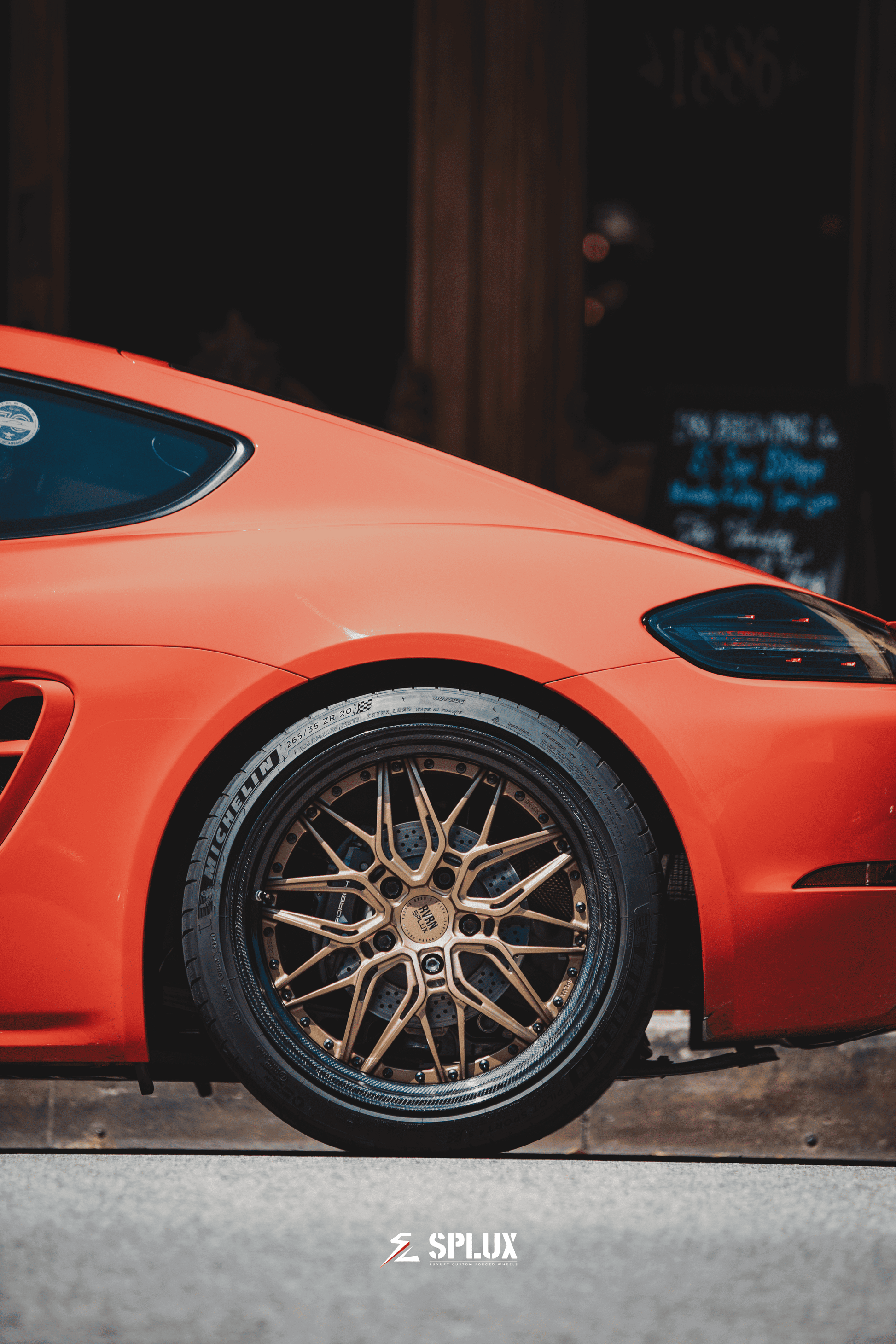 Porsche with Splux SD-01S forged rims featuring carbon fiber wrapped lip, bronze finish, and luxury deep dish design.