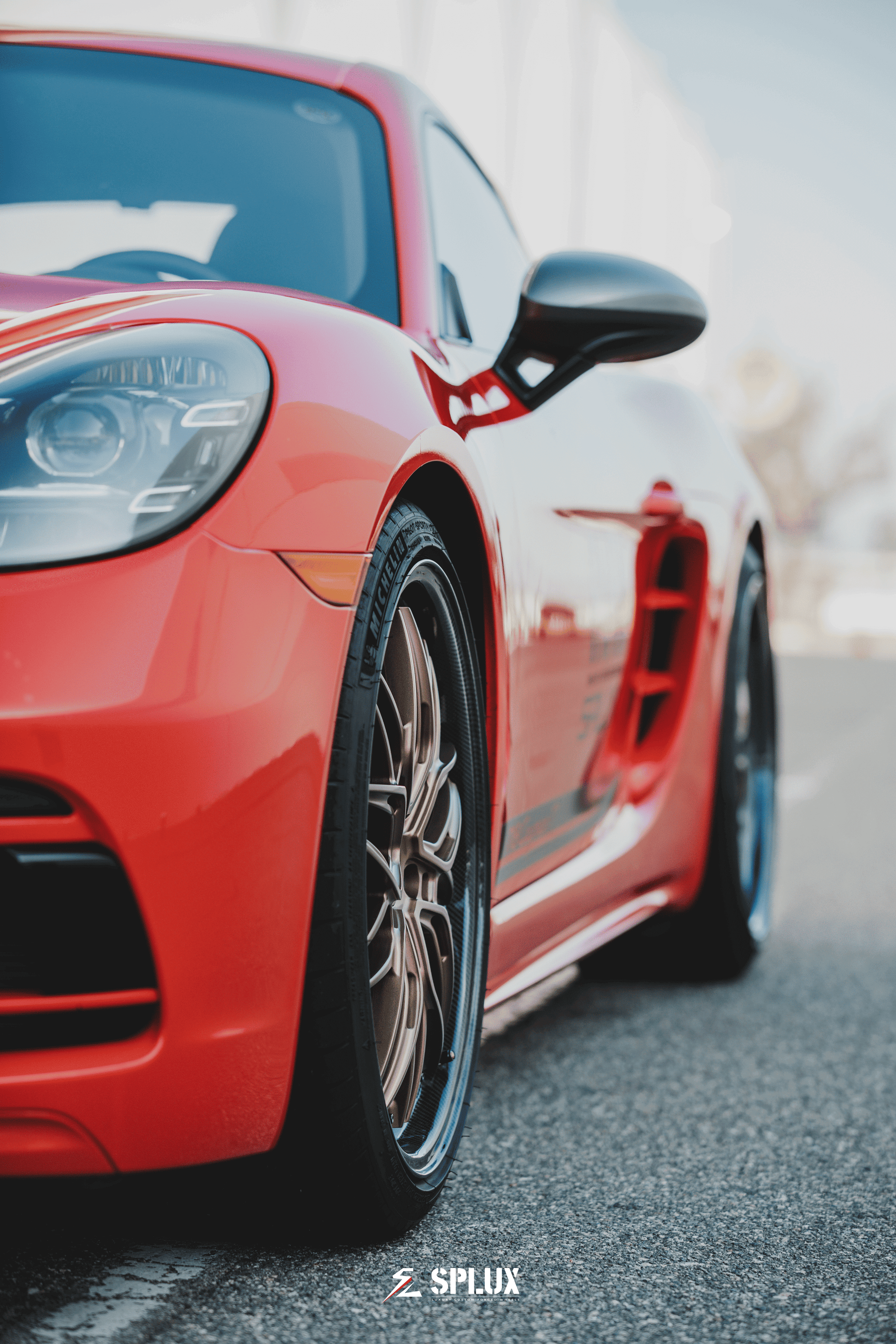 Porsche with Splux SD-01S Forged Wheels: luxury bronze deep dish rims with carbon fiber lip, showcasing high performance.
