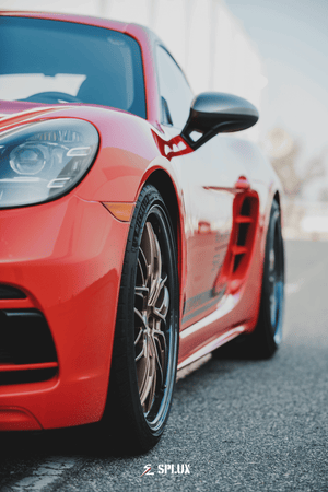 Porsche with Splux SD-01S Forged Wheels: luxury bronze deep dish rims with carbon fiber lip, showcasing high performance.