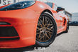 Luxury Porsche aftermarket rims: Splux SD-01S Bronze deep dish wheels with carbon fiber wrapped lip for high performance.