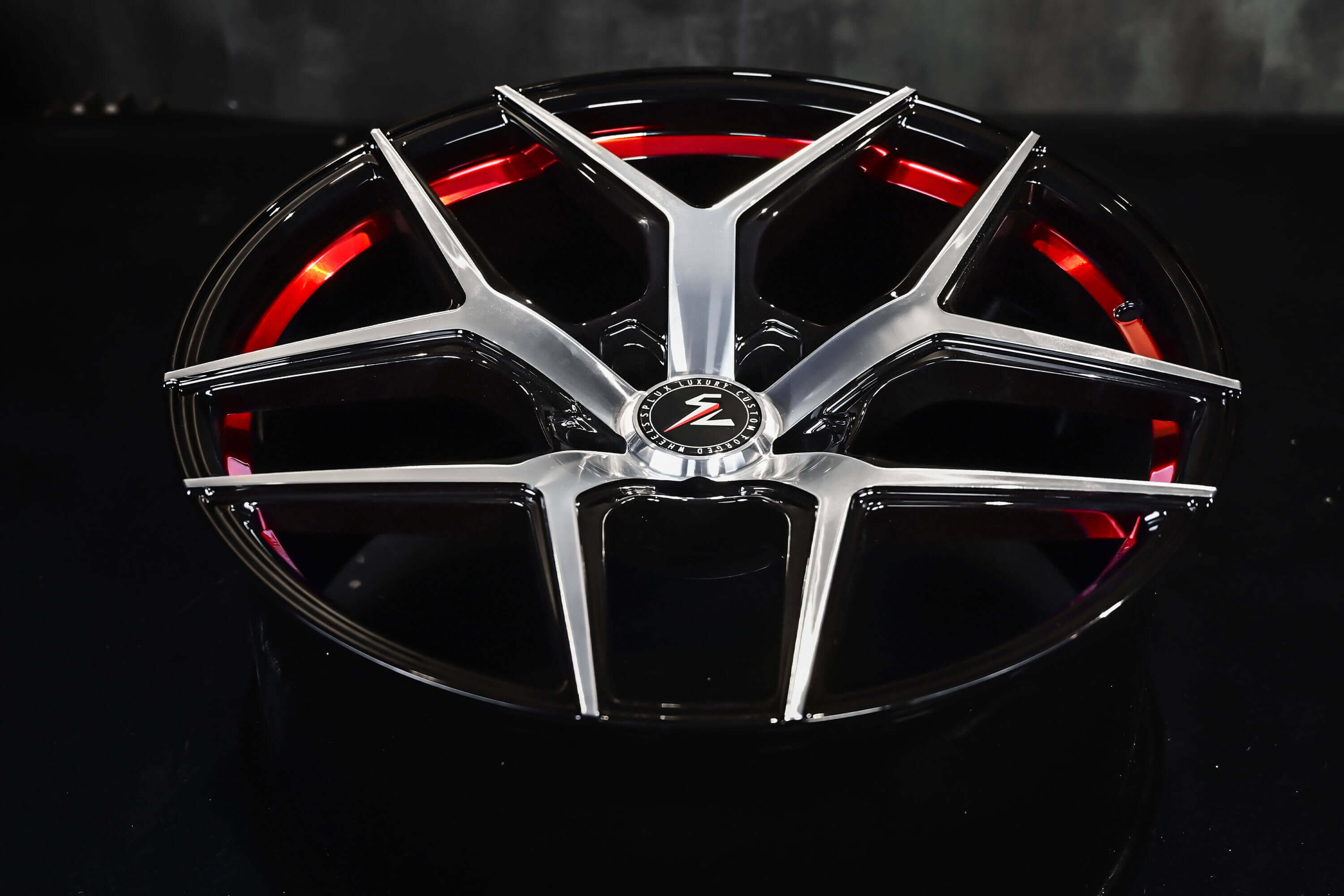 Custom forged 1-piece Splux SL-01 21-inch rims for 2023 Tesla Model S, lightweight, machined, black with red stripe and concave design.