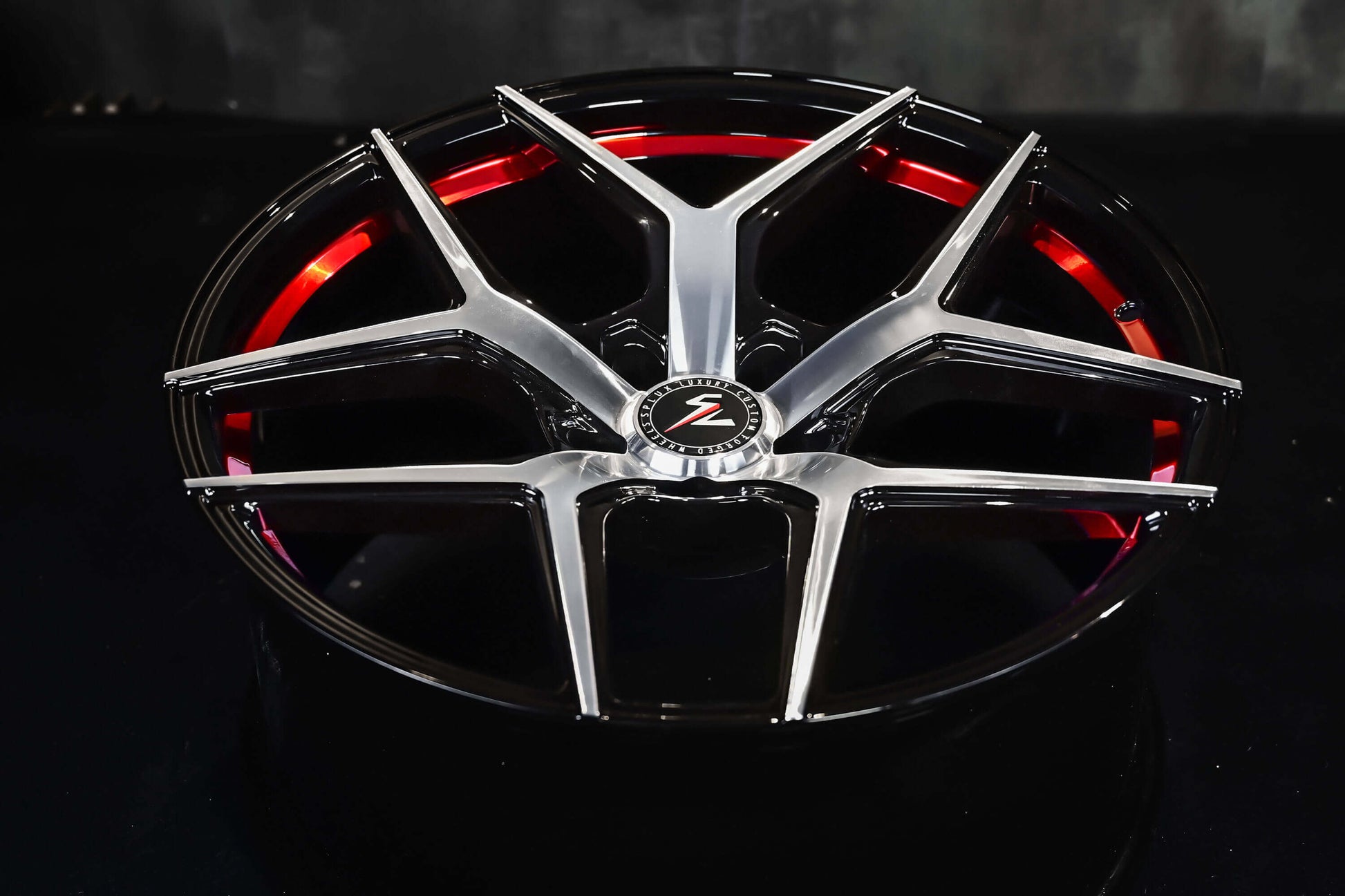 Custom forged 1-piece Splux SL-01 21-inch rims for 2023 Tesla Model S, lightweight, machined, black with red stripe and concave design.