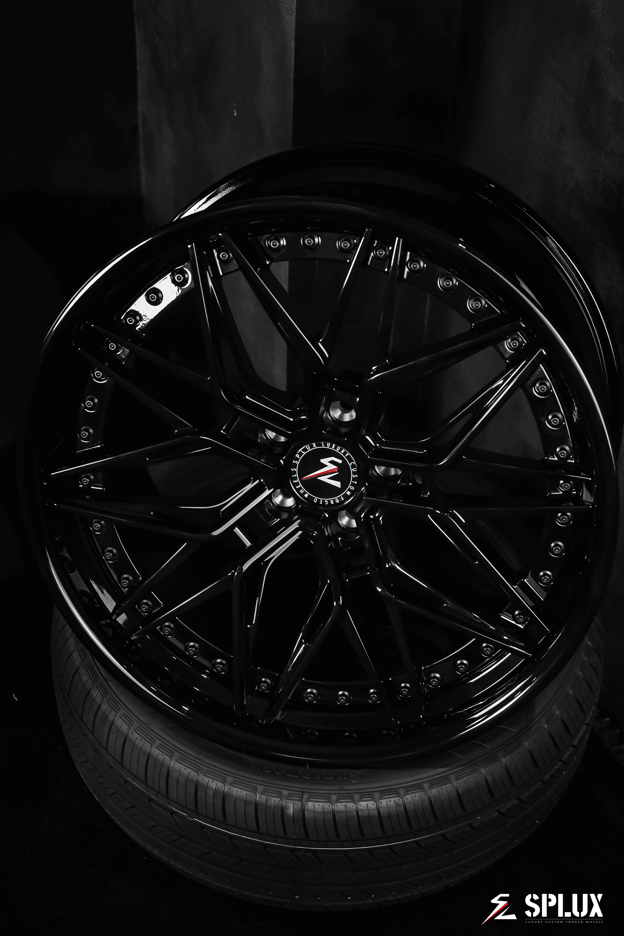 2012 Tesla Model S with Splux SC-02 custom forged 2-piece black 22-inch wheels. Aggressive, concave, deep dish luxury aftermarket rims.