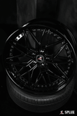 2012 Tesla Model S with Splux SC-02 custom forged 2-piece black 22-inch wheels. Aggressive, concave, deep dish luxury aftermarket rims.
