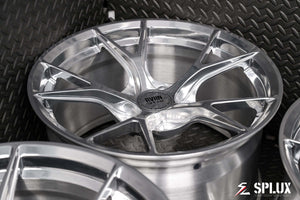 porsche 718 aftermarket wheels with raw polished aluminum finish. deep concave and lightweight design.