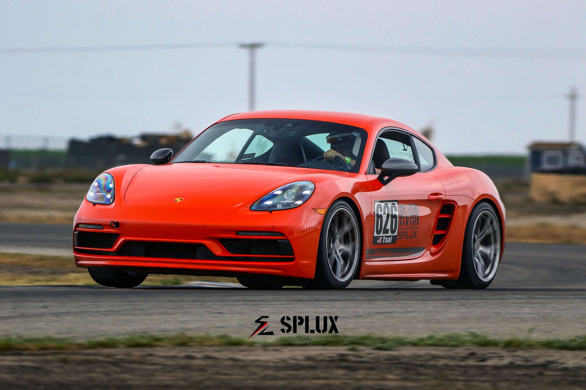 Porsche 718 Cayman racing with Splux SL-03R forged monoblock wheels during tamale track days, showcasing super lightweight design.