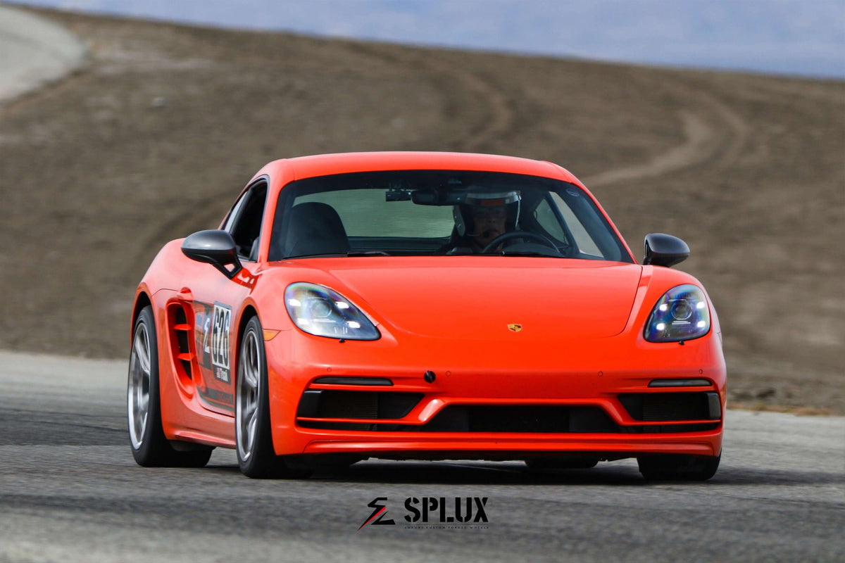 Porsche 718 Cayman in vibrant orange on tamale track days, showcasing super lightweight SL-03R wheels with concave Y-spoke design.