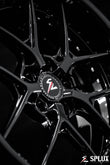 Front 18-inch SD-02 wheel with piano black spokes and barrel, five lug holes visible