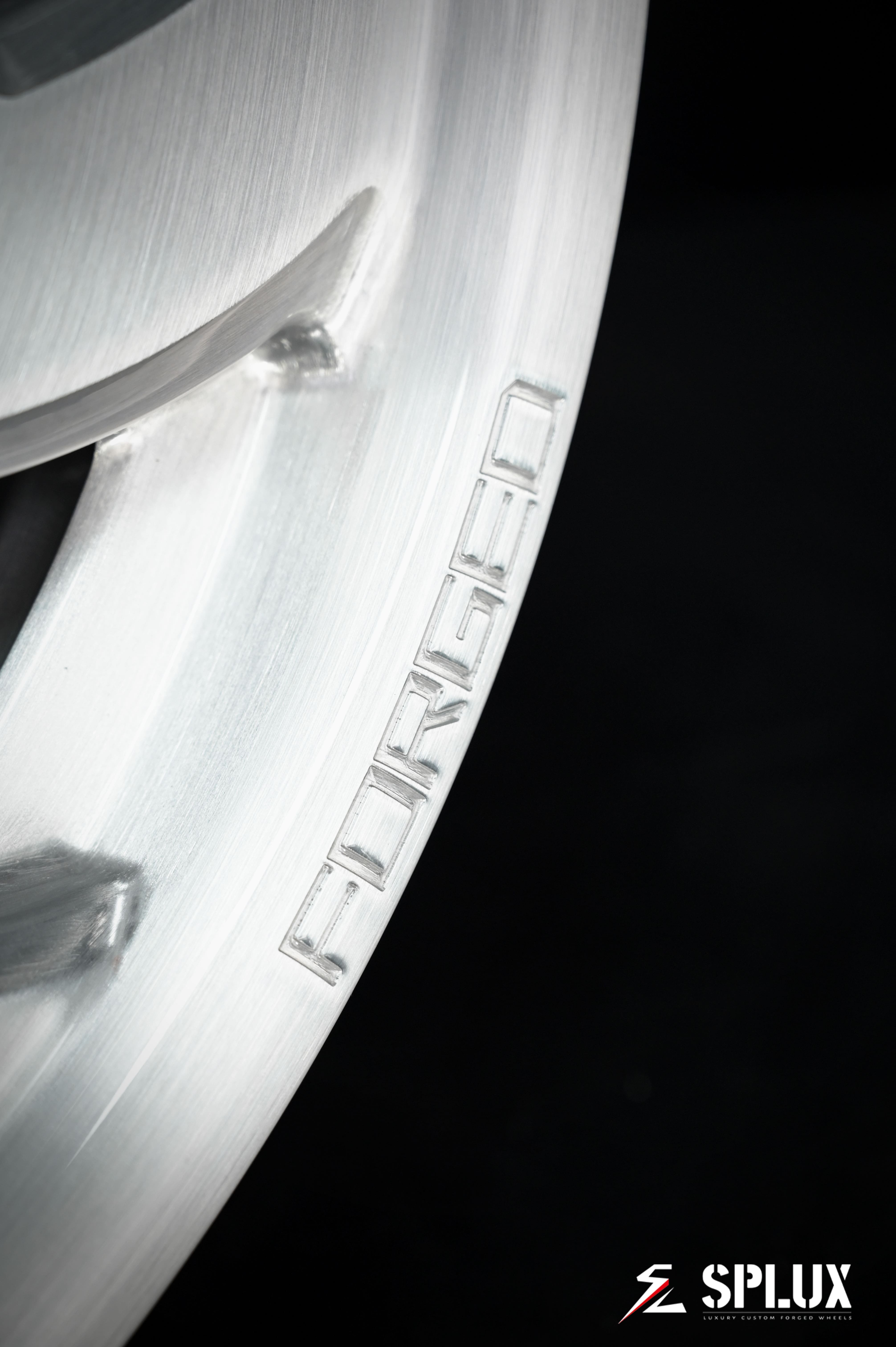 Brushed aluminum SA-10 wheel with visible lug holes and center cap on a 1994 Corvette