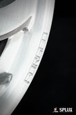 Brushed aluminum SA-10 wheel with visible lug holes and center cap on a 1994 Corvette