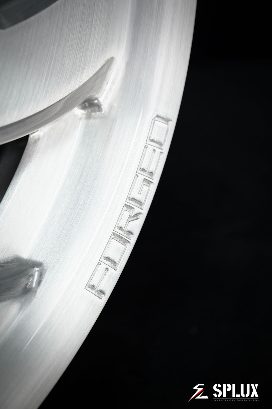 Brushed aluminum SA-10 wheel with visible lug holes and center cap on a 1994 Corvette