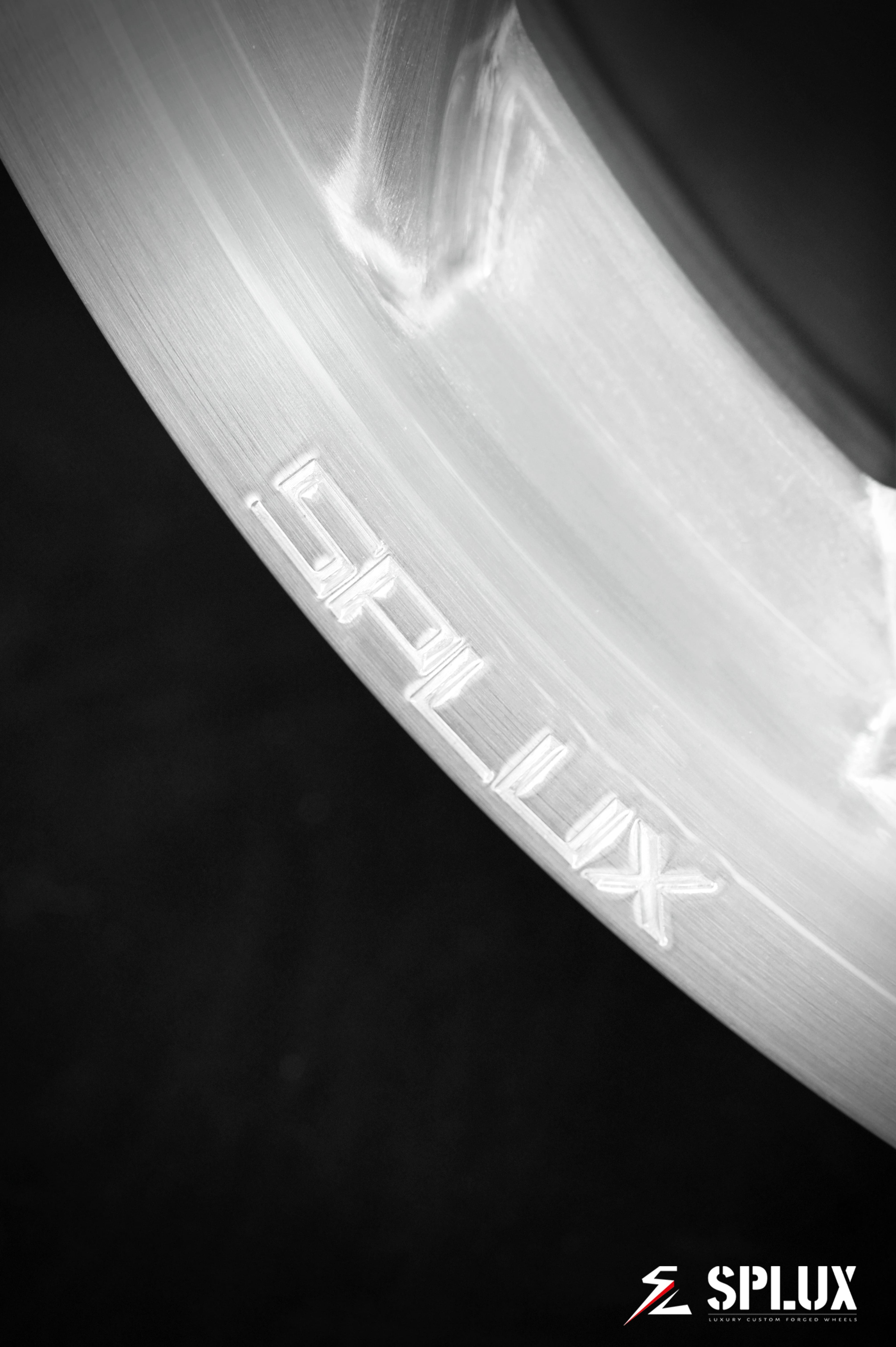 Rear SA-10 wheel with brushed aluminum surface and directional design on a Corvette C4