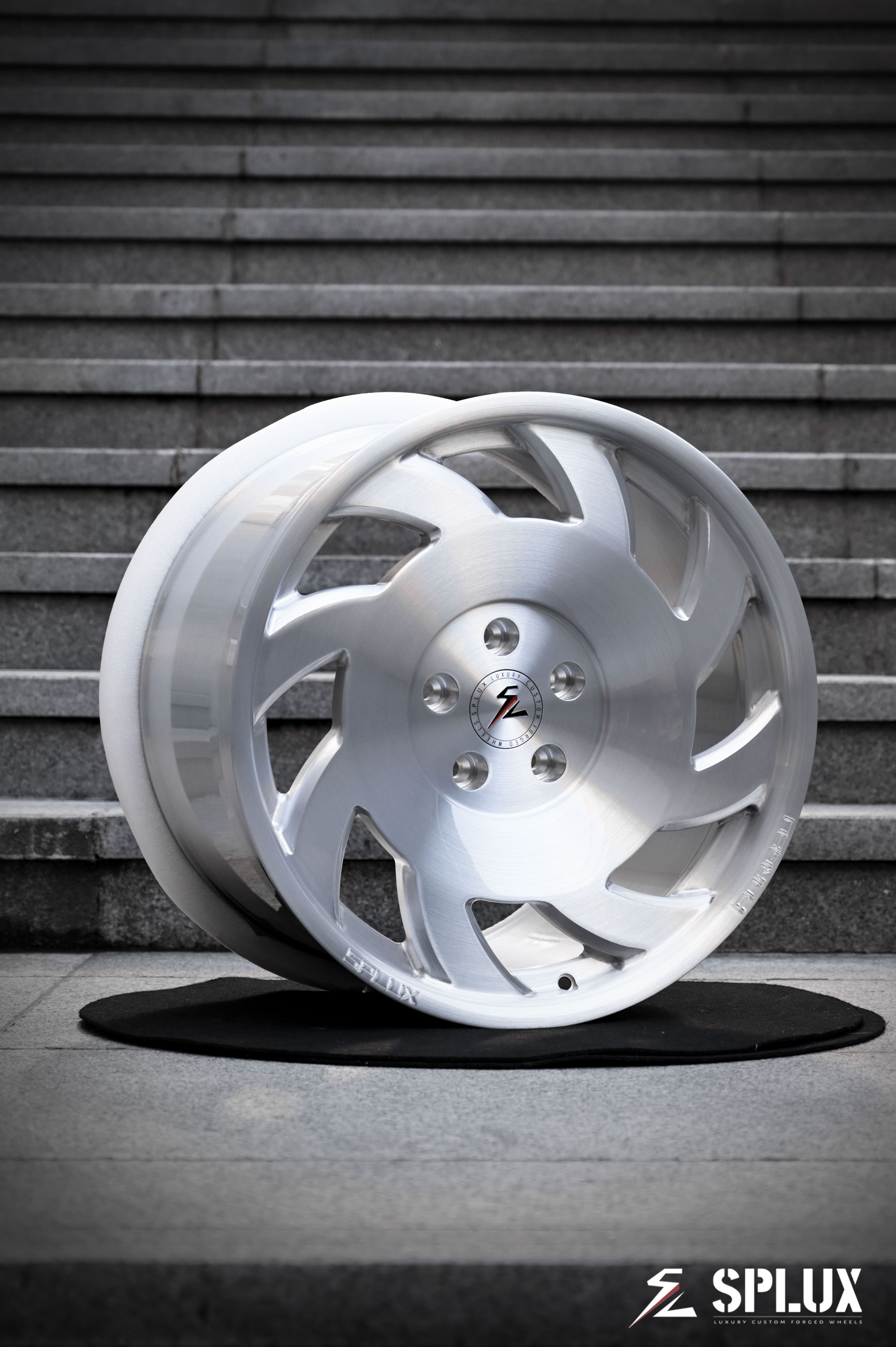 SA-10 forged wheel with directional spokes and brushed aluminum finish on the front of a C4 Corvette