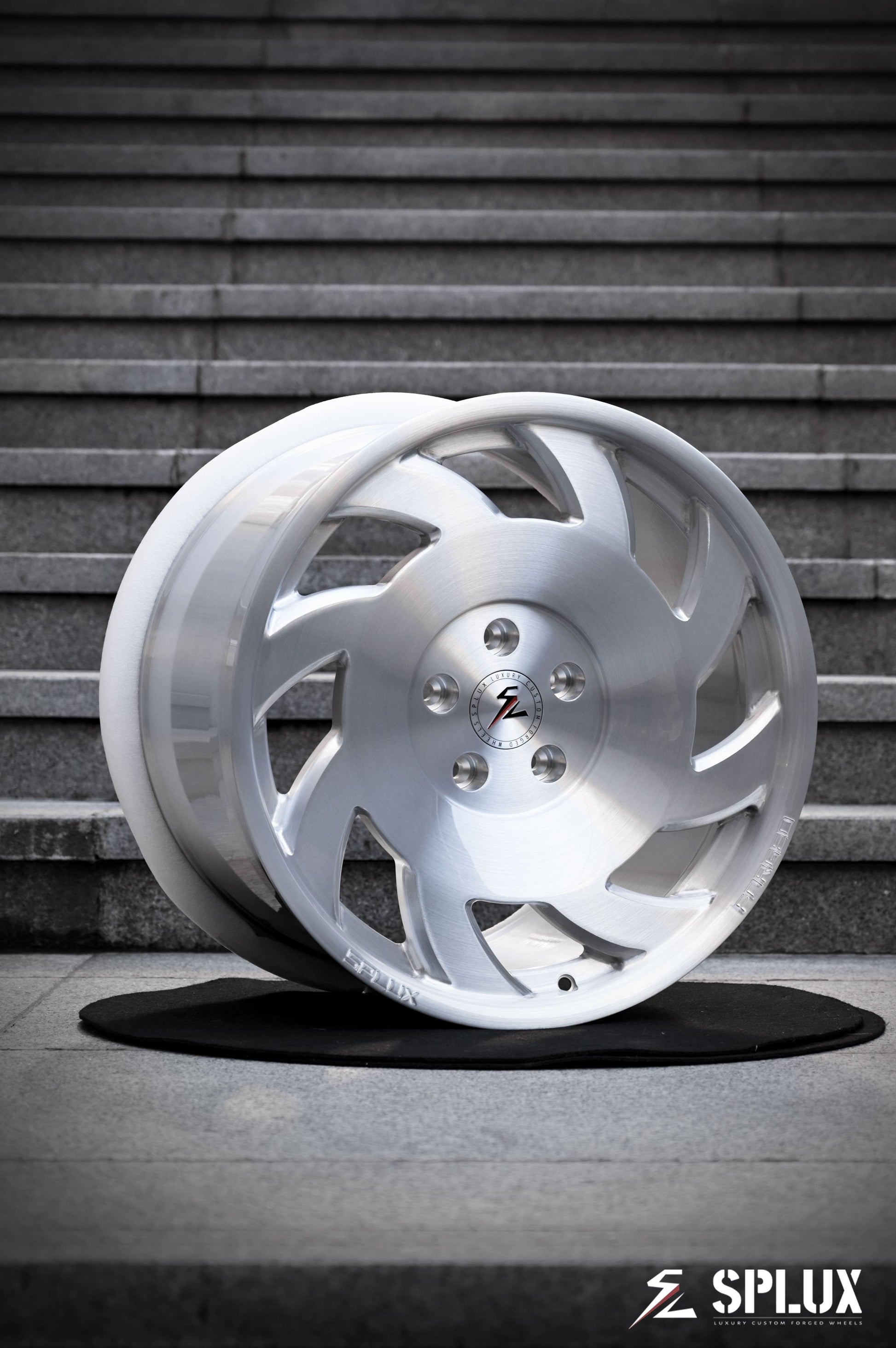 SA-10 forged wheel with directional spokes and brushed aluminum finish on the front of a C4 Corvette