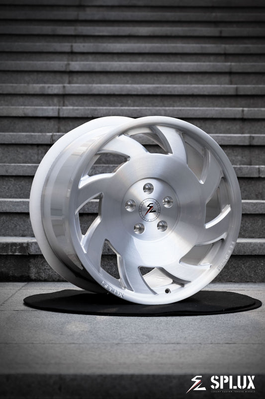 SA-10 forged wheel with directional spokes and brushed aluminum finish on the front of a C4 Corvette