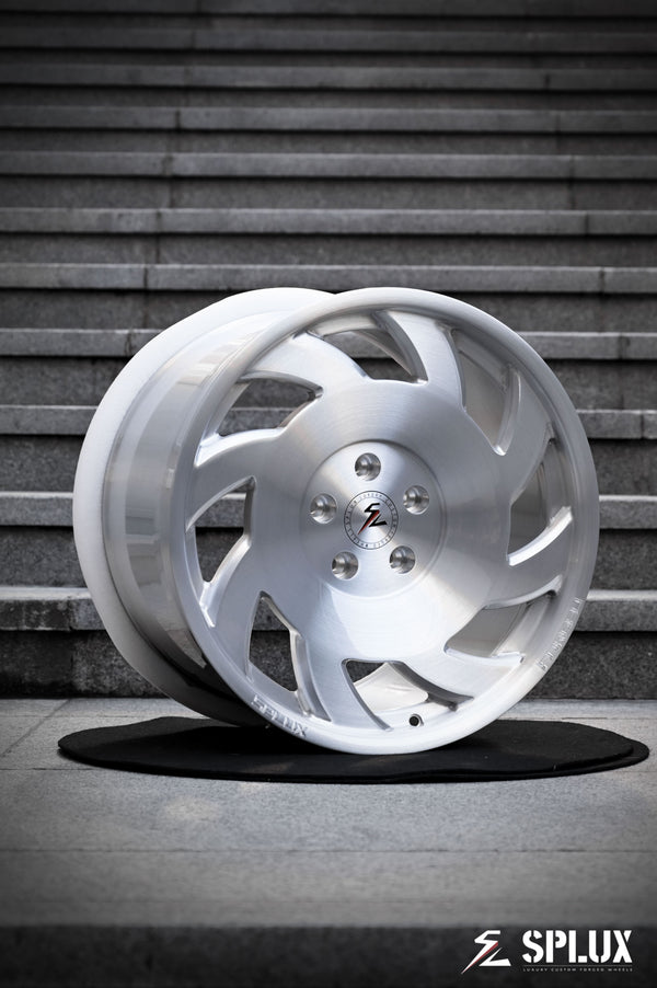 SA-10 forged wheel with directional spokes and brushed aluminum finish on the front of a C4 Corvette