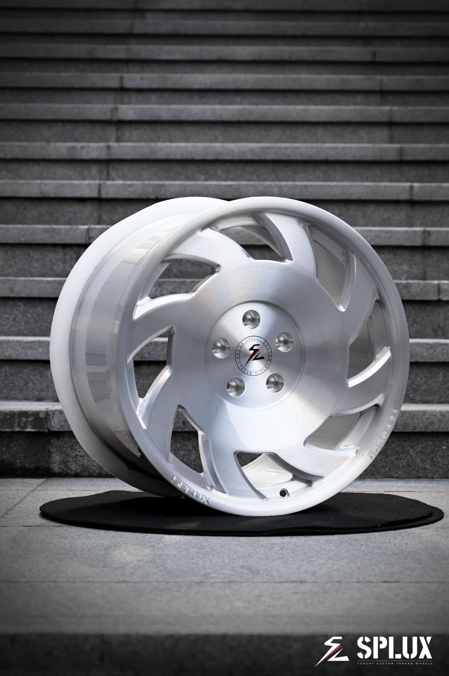 SA-10 forged wheel with directional spokes and brushed aluminum finish on the front of a C4 Corvette