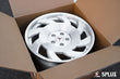 Rear 18x10.5 SA-10 wheel with brushed aluminum surface and visible lug holes on a C4 Corvette