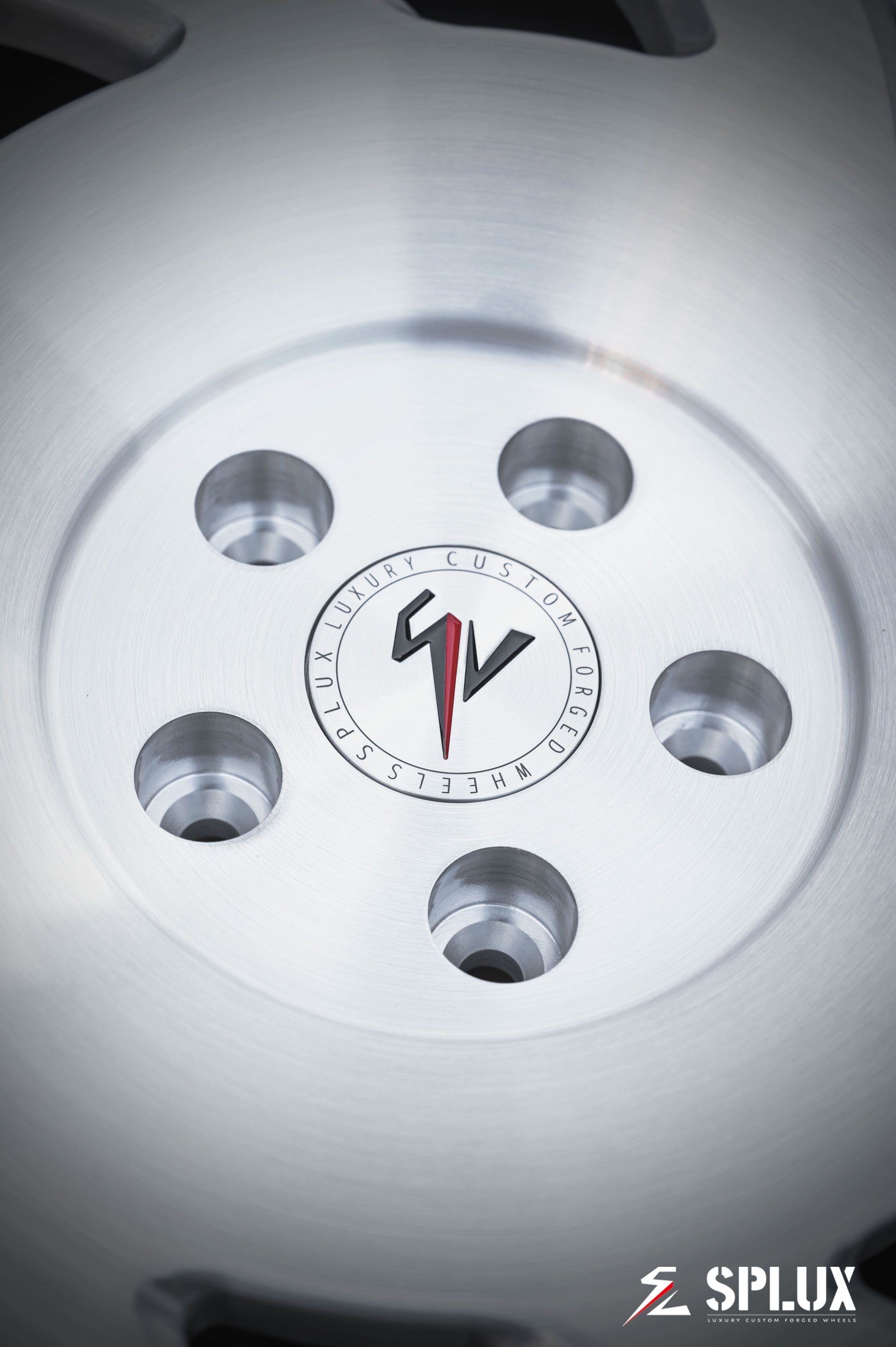 Close-up of SA-10 forged wheel showing brushed aluminum texture and directional spoke pattern