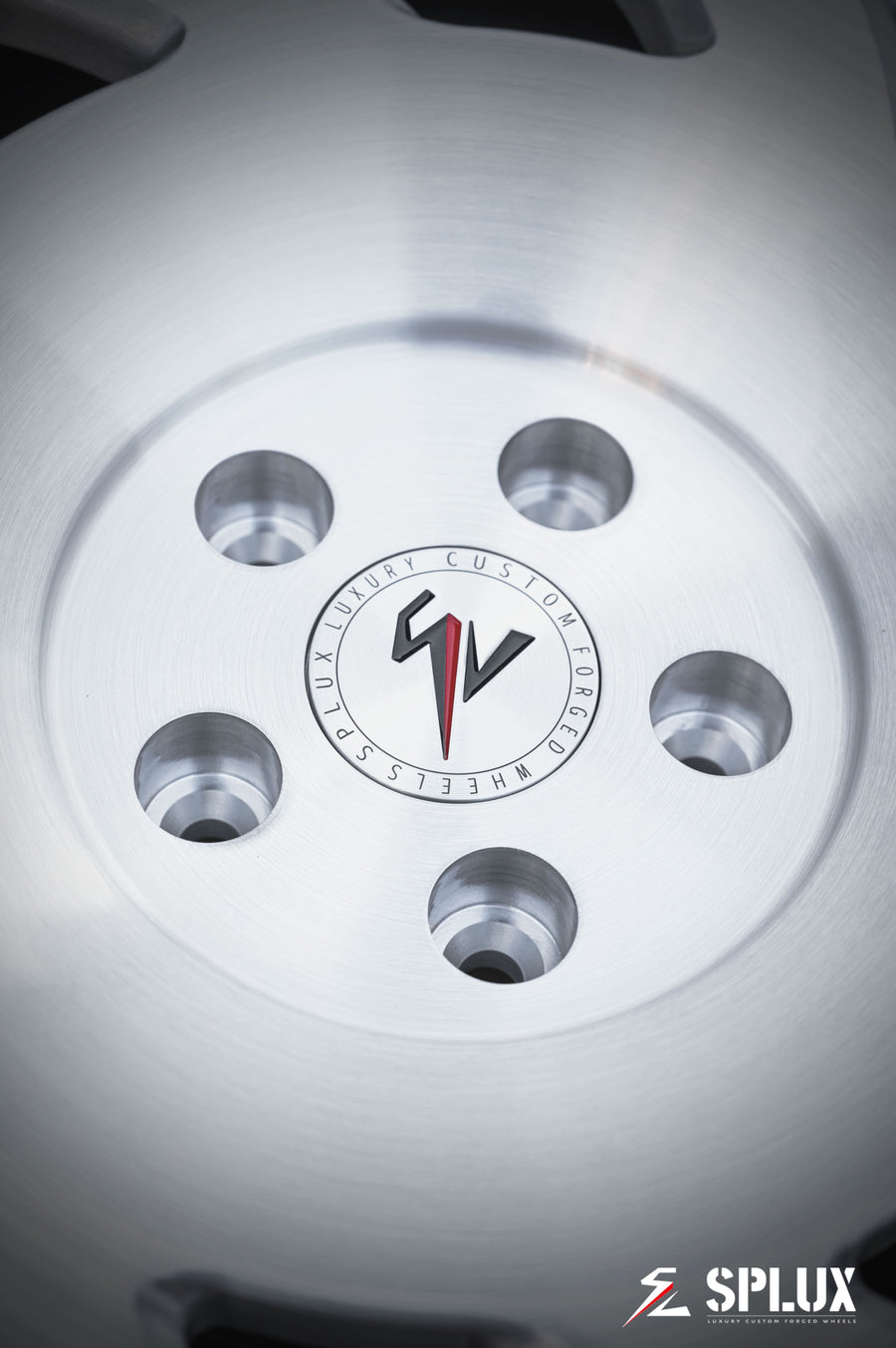 Close-up of SA-10 forged wheel showing brushed aluminum texture and directional spoke pattern