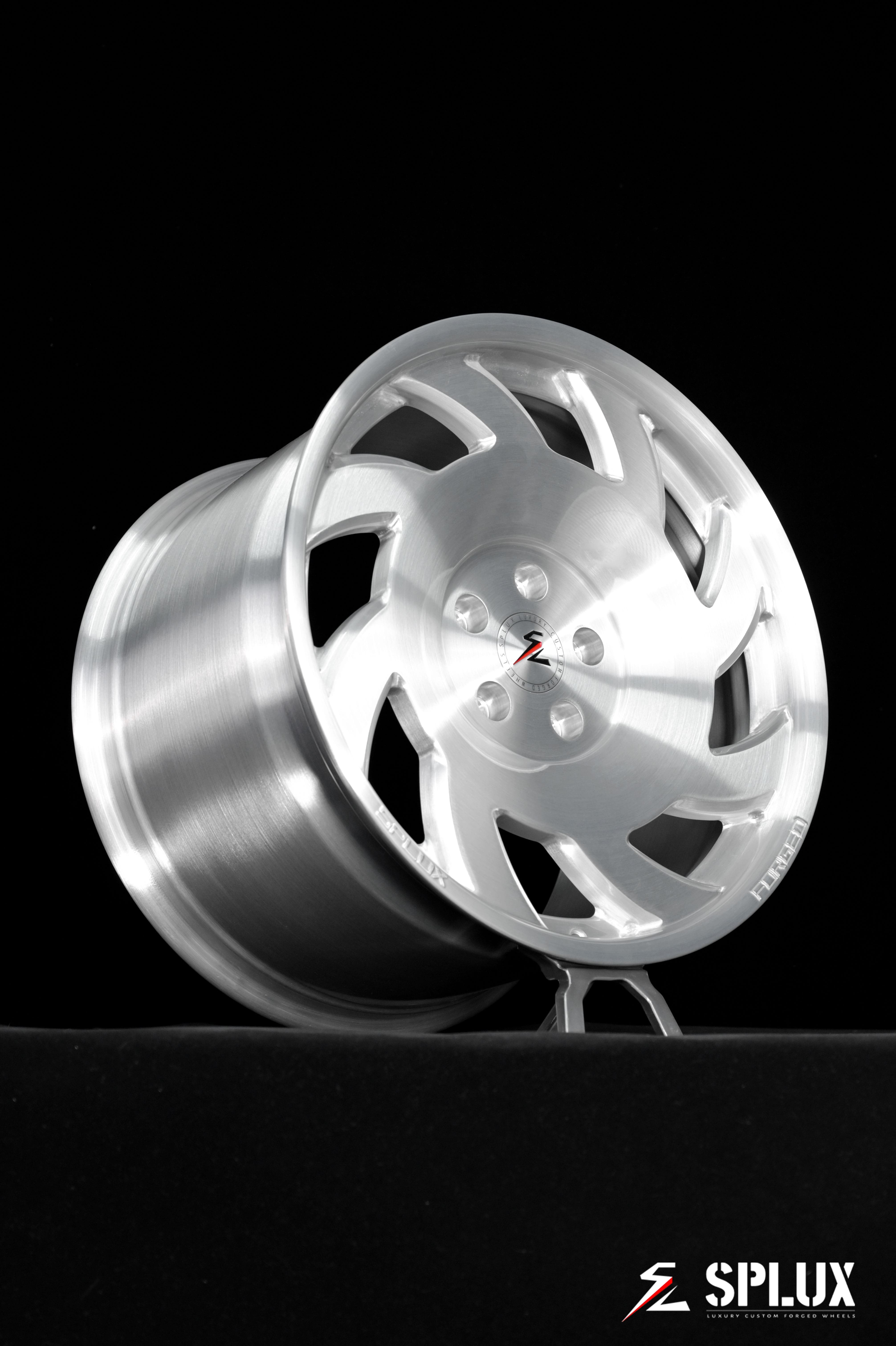 SA-10 wheel with directional spokes and brushed aluminum finish on the rear of a C4 Corvette
