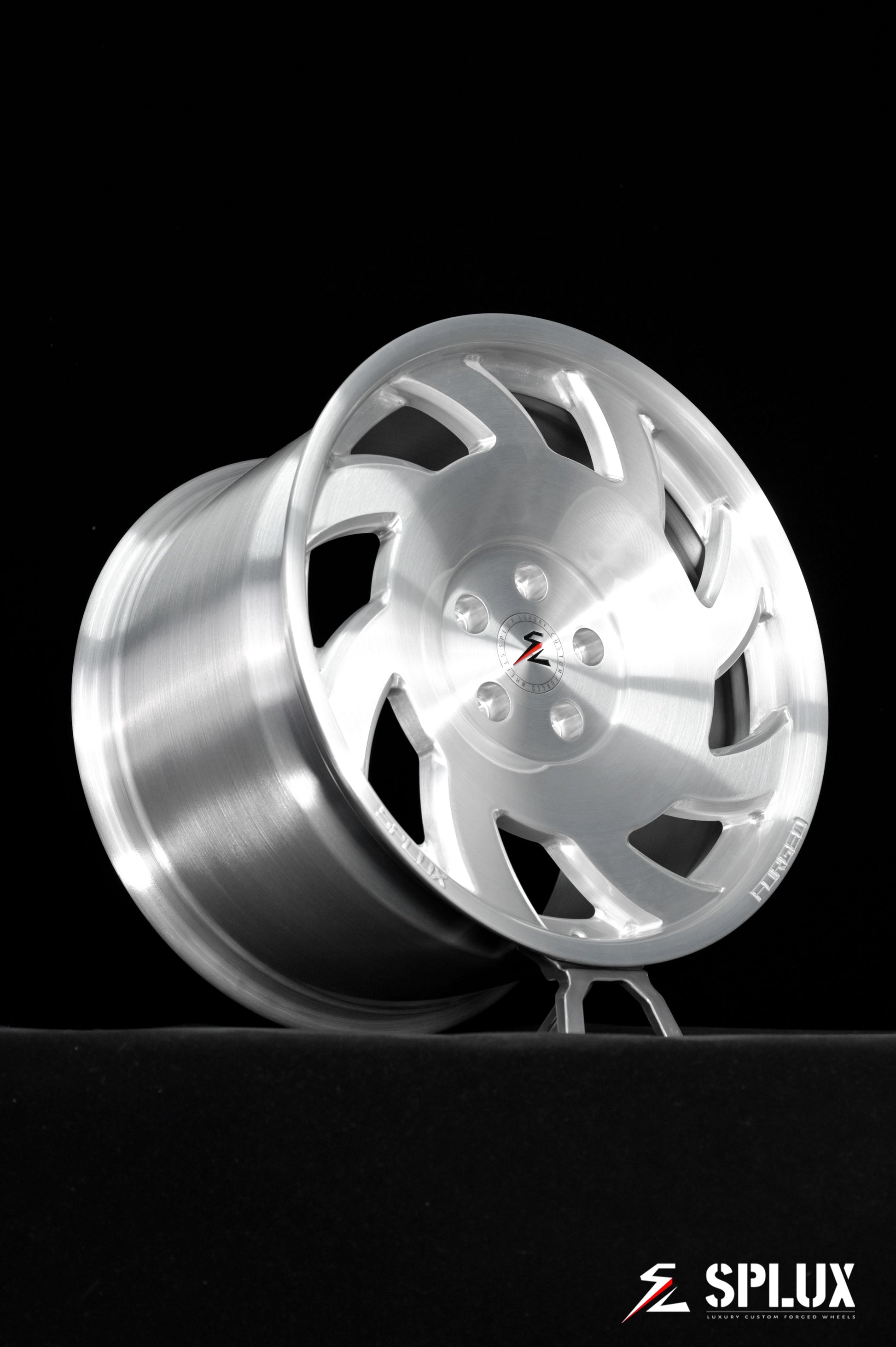SA-10 wheel with directional spokes and brushed aluminum finish on the rear of a C4 Corvette