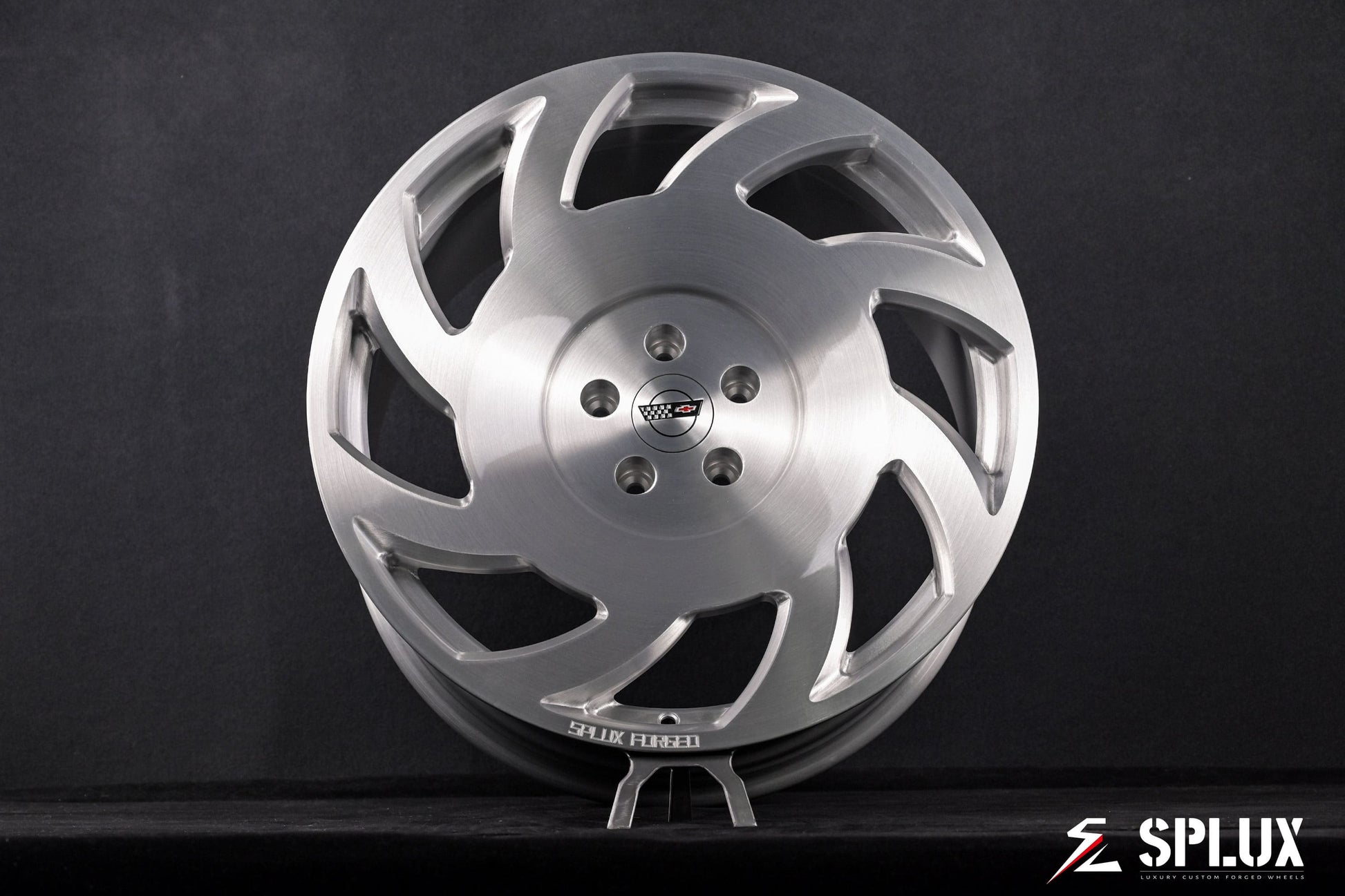 Close-up of the SA-10 wheel's directional spoke pattern and brushed aluminum texture