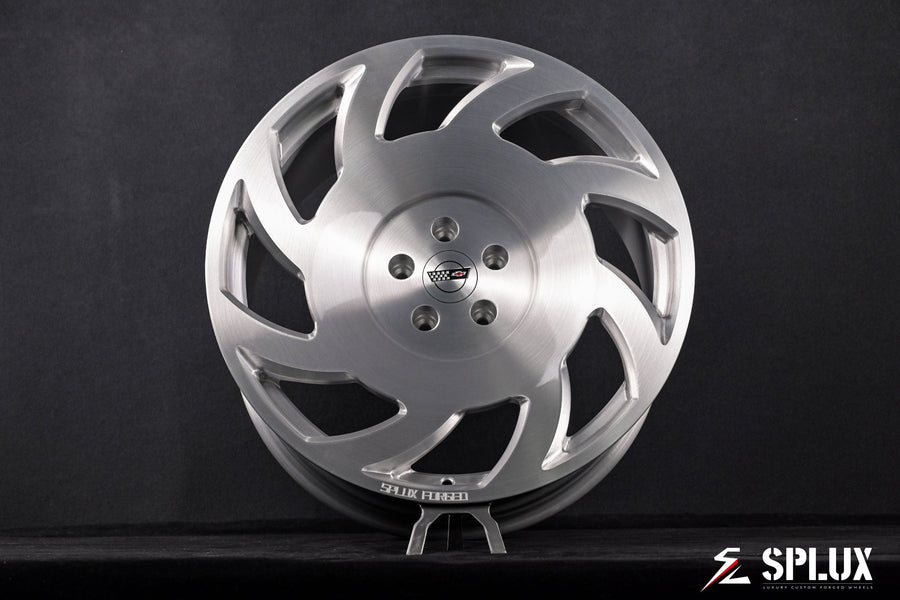 Close-up of the SA-10 wheel's directional spoke pattern and brushed aluminum texture