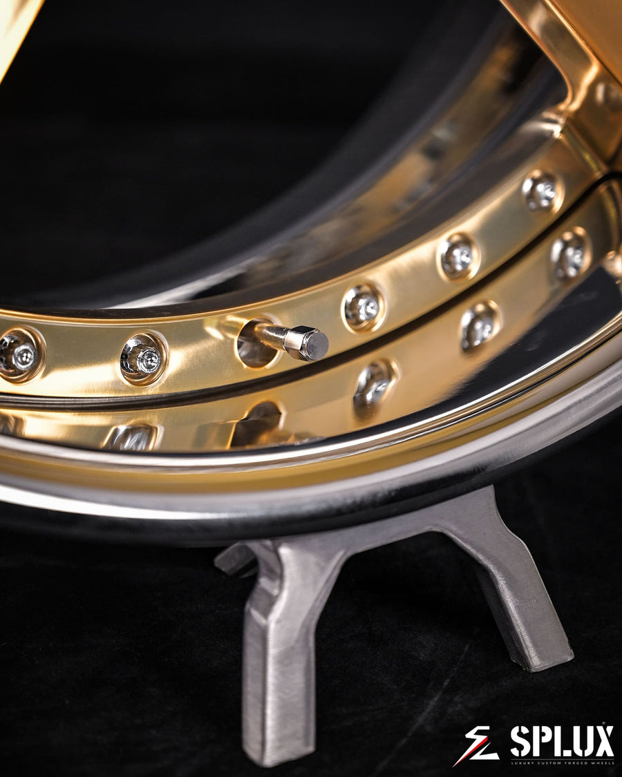 Close-up of the SD-06 wheel showing the polished frozen gold spokes and chrome rim