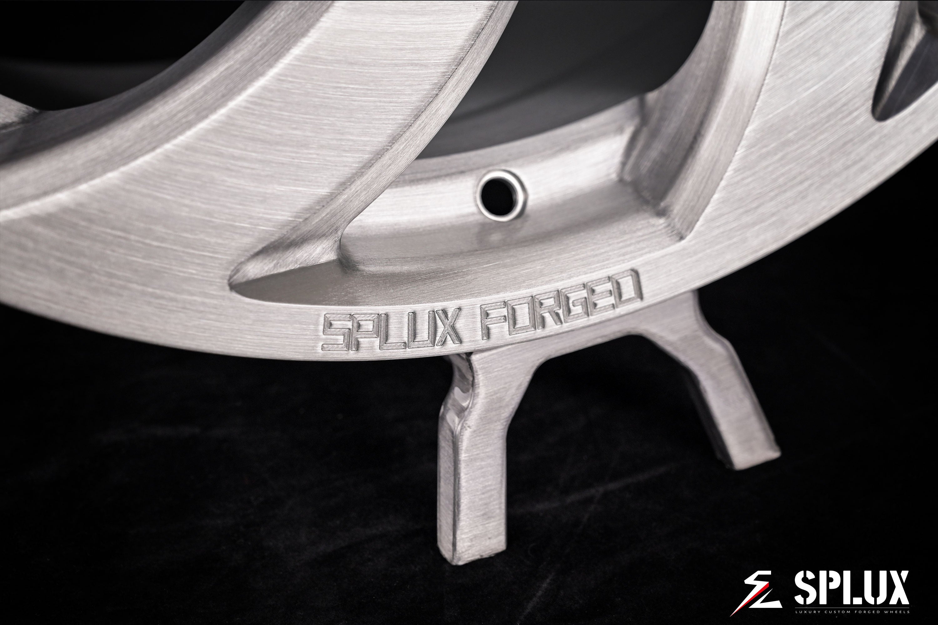 Close-up of the SA-10 forged wheel showing brushed surface and directional spoke pattern