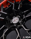2011 wrx aftermarket wheels gloss black barrel and red lip close-up
