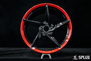Front 20-inch SC-09M forged wheel with black diamond spokes and a gloss red lip