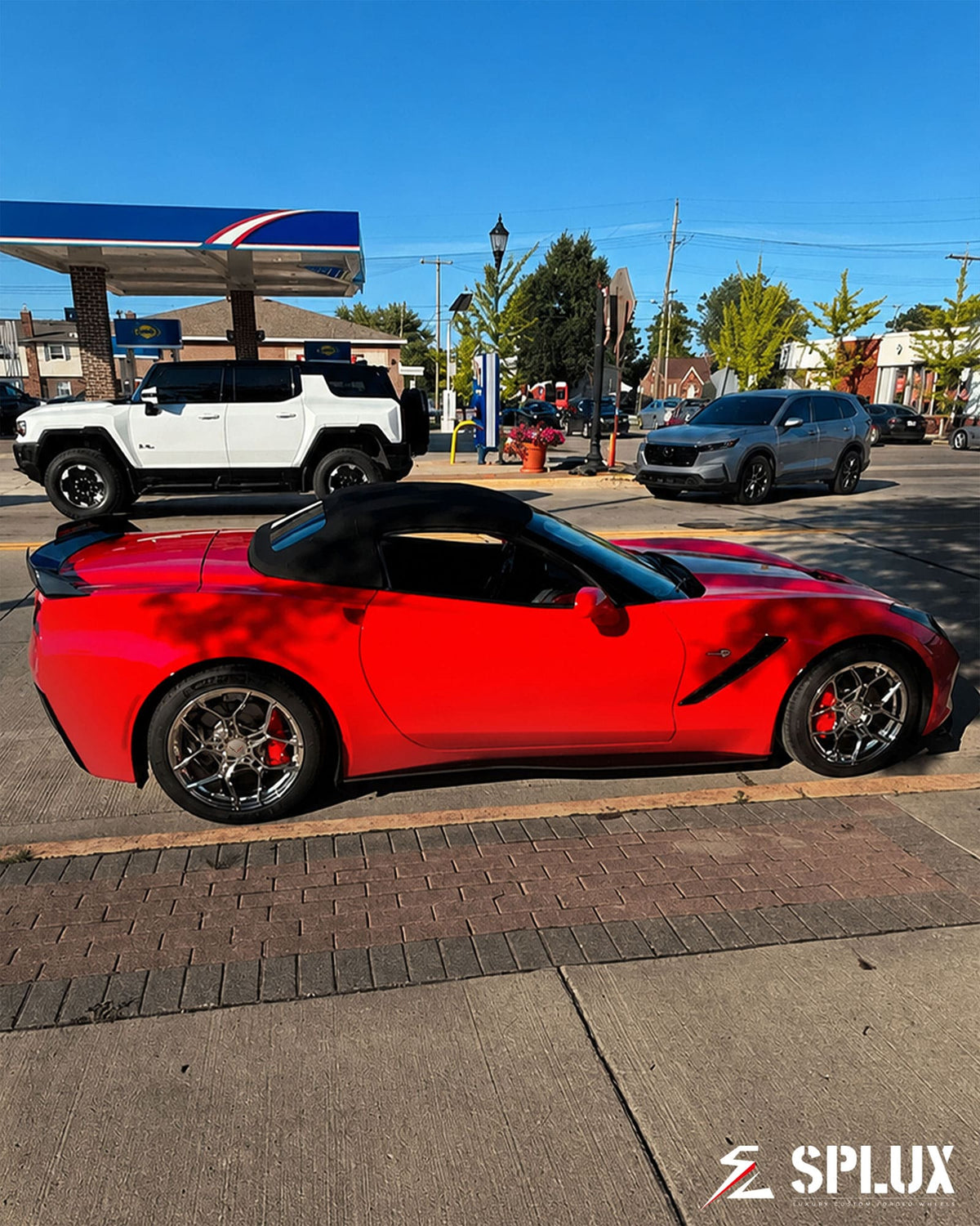 SC-18M wheel with chrome finish and red Corvette in background