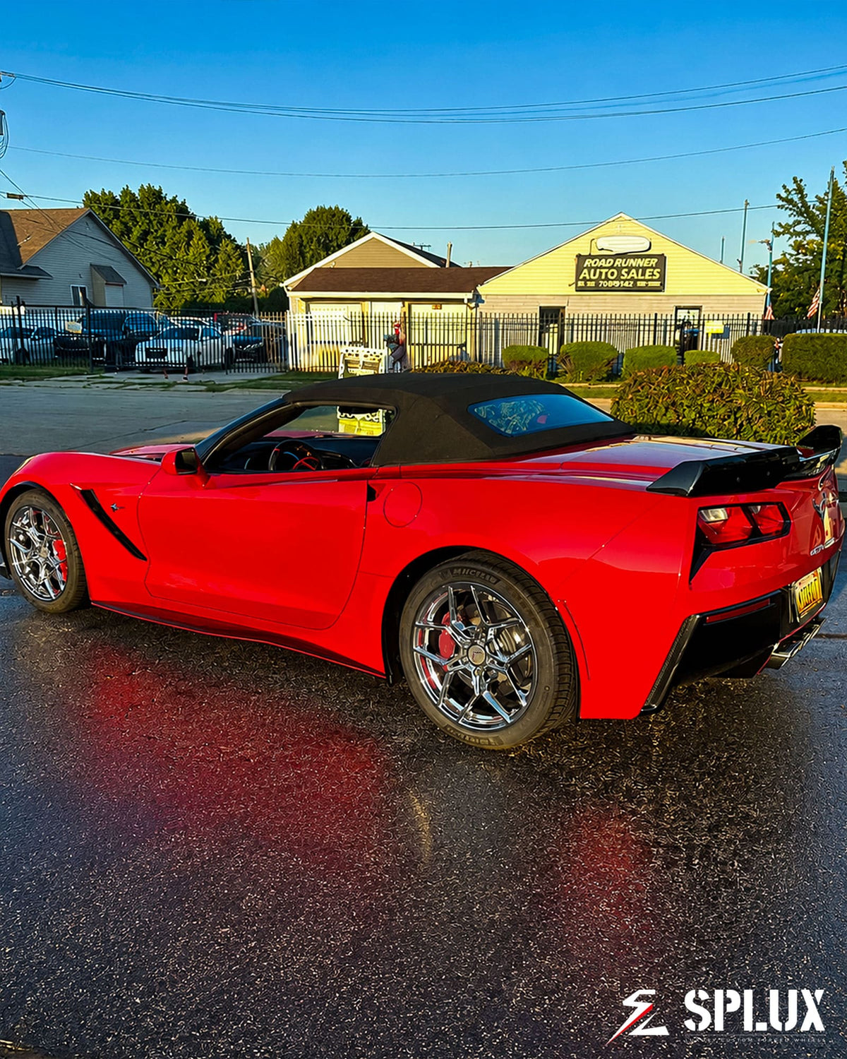 C7 Corvette parked with SC-18M wheels, red body and chrome rims