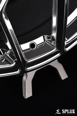 The front wheel of the C7 with a chrome finish and the SC-18M design, highlighting the lug pattern