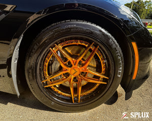 SA-01 forged wheel with piano black step lip and custom center cap on black Corvette