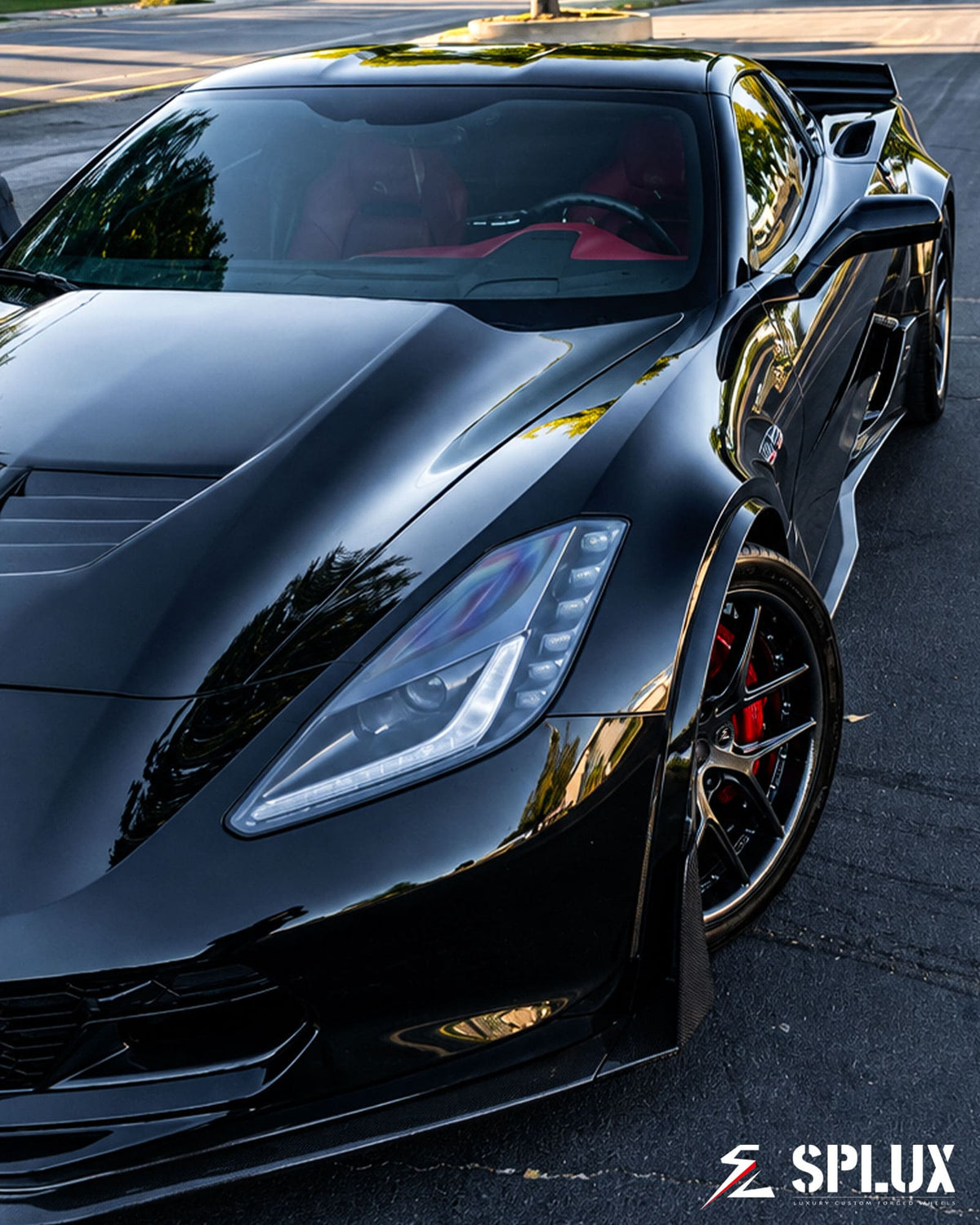 Close-up of the SD-02 rear wheel, showing the deep dish and gunmetal finish on the C7 Z06