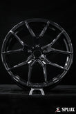Close-up of the SC-04M forged wheel showing the monoblock construction and black center cap