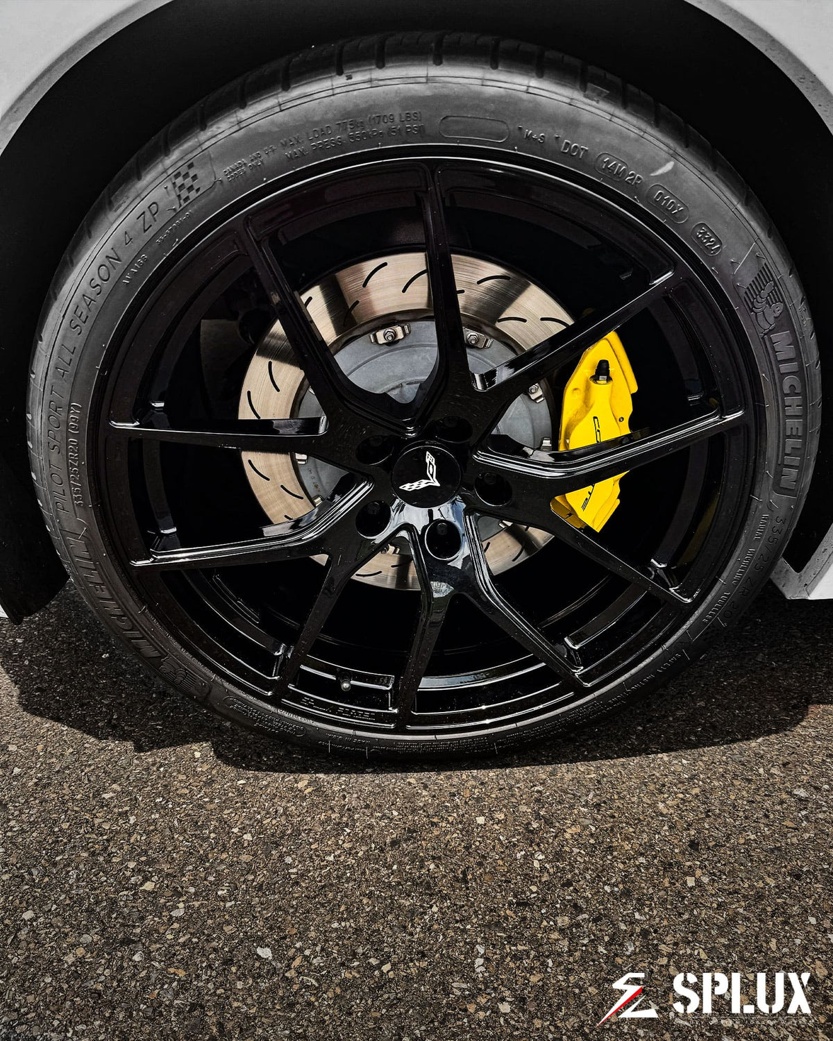 C7 Grand Sport with forged wheels, showing the aggressive stance and black rims