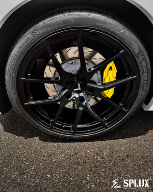 C7 Grand Sport with forged wheels, showing the aggressive stance and black rims