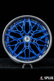 Rear SC-02 wheel showing the concave profile and chrome blue spokes on the 340i