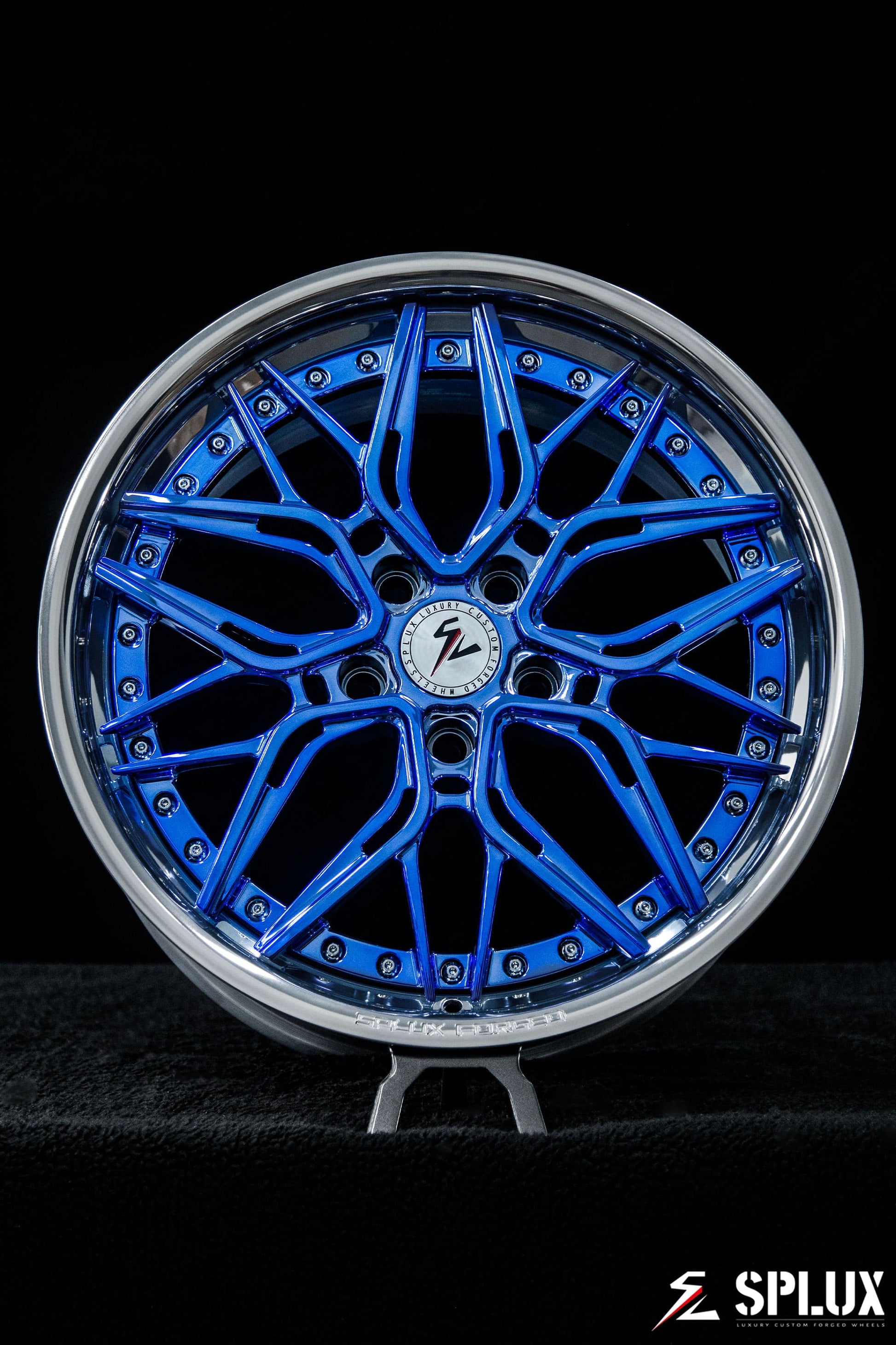 Rear SC-02 wheel showing the concave profile and chrome blue spokes on the 340i