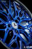 Close-up of the SC-02 wheel's polished barrel and chrome blue spokes with visible lug holes