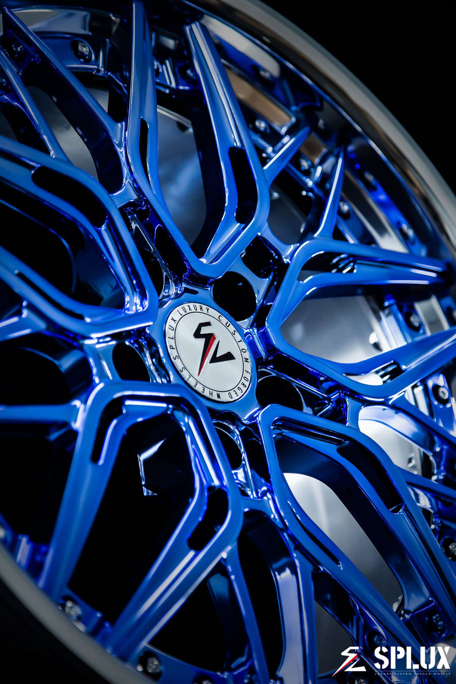 Close-up of the SC-02 wheel's polished barrel and chrome blue spokes with visible lug holes