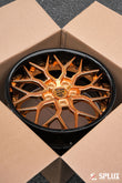Custom Porsche logo center cap on the Polished Copper SA-01 wheel